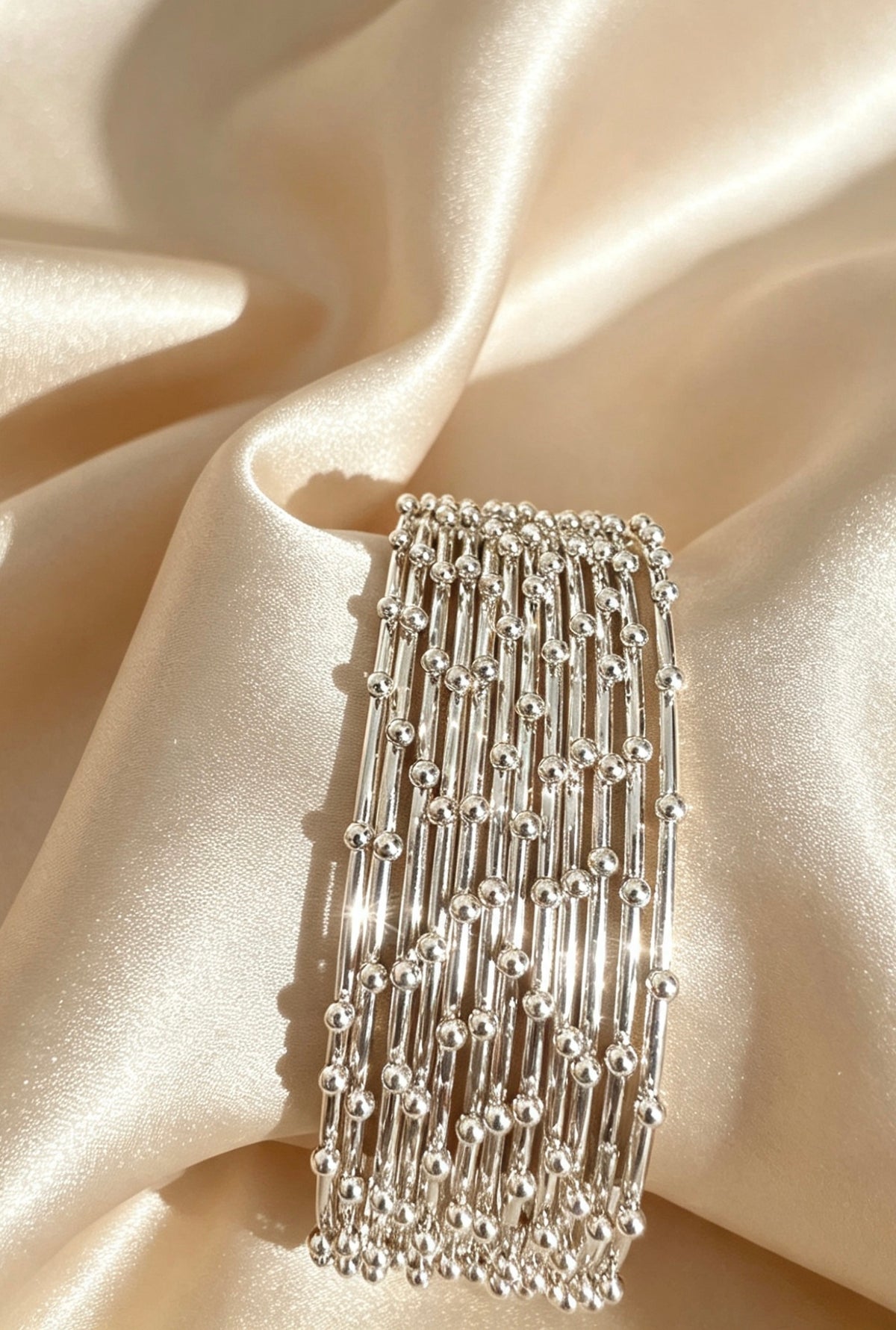 Woven Gold-Accent Metal Bangle Stack