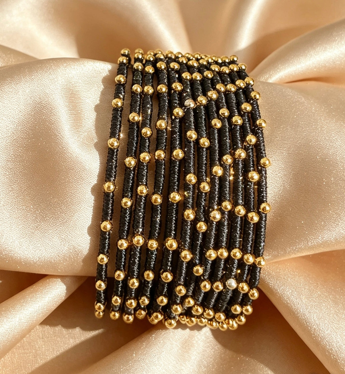 Woven Gold-Accent Metal Bangle Stack