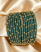 Woven Gold-Accent Metal Bangle Stack